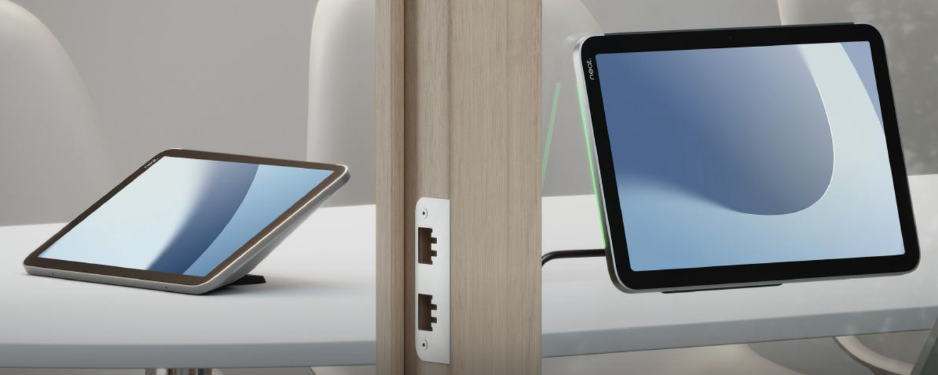 Two neat pad pro's mounted in different ways. One with a stand on the table serving as room controller and the other in a glass door, serving as room scheduler.