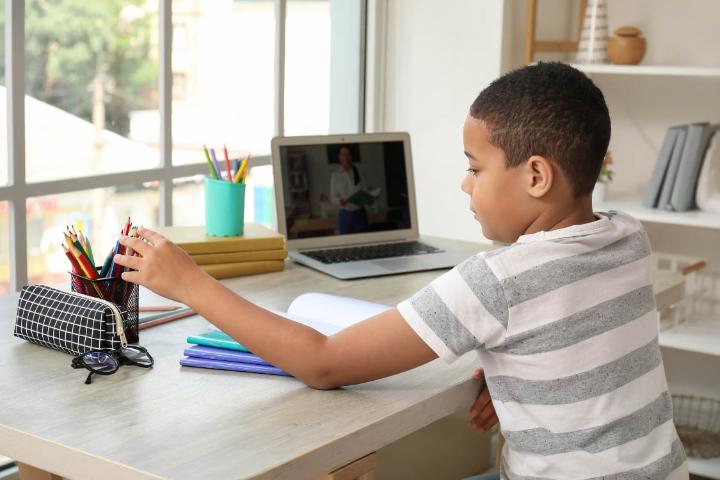 Parent helping a child browse the internet safely in Egypt